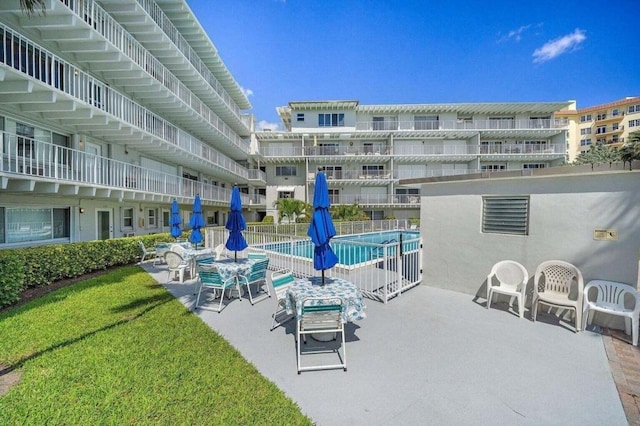 3500 S Ocean Blvd Unit 308, South Palm Beach, FL 33480 - view of patio featuring a community pool