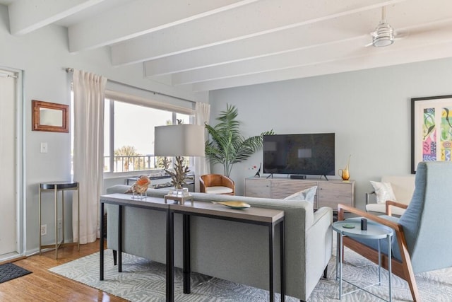 3500 S Ocean Blvd Unit 308, South Palm Beach, FL 33480 - living area featuring beamed ceiling and wood finished floors