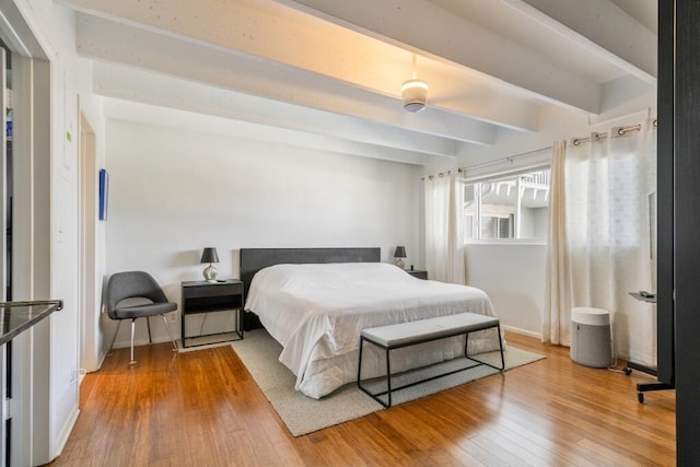 3500 S Ocean Blvd Unit 308, South Palm Beach, FL 33480 - bedroom featuring beamed ceiling and wood finished floors