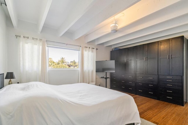 3500 S Ocean Blvd Unit 308, South Palm Beach, FL 33480 - bedroom featuring beamed ceiling and light wood-style flooring