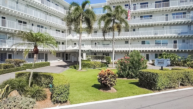 3500 S Ocean Blvd Unit 308, South Palm Beach, FL 33480 - surrounding community with a yard