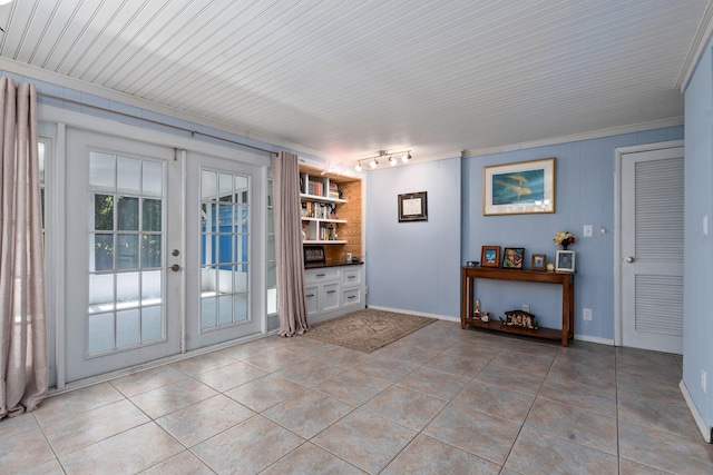 2560 50th Ave, Vero Beach, FL 32966 - entryway featuring french doors, light tile patterned floors, track lighting, baseboards, and ornamental molding