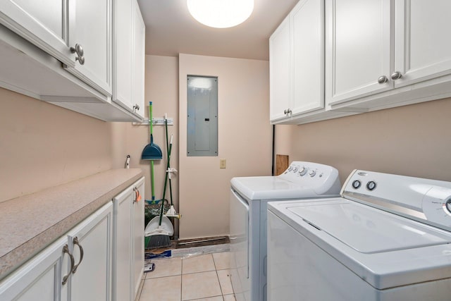 2560 50th Ave, Vero Beach, FL 32966 - laundry room featuring separate washer and dryer, electric panel, cabinet space, and light tile patterned floors