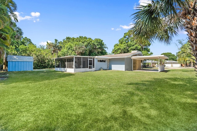 2560 50th Ave, Vero Beach, FL 32966 - back of property featuring a sunroom, a lawn, and a chimney