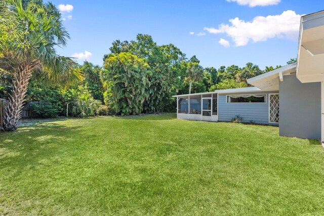 2560 50th Ave, Vero Beach, FL 32966 - view of green lawn with a sunroom