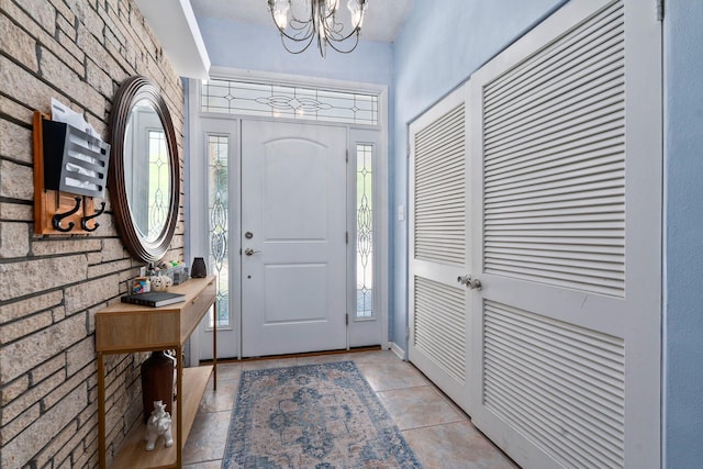 2560 50th Ave, Vero Beach, FL 32966 - foyer with plenty of natural light and a chandelier