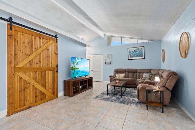 2560 50th Ave, Vero Beach, FL 32966 - tiled living area with a barn door, baseboards, and a textured ceiling
