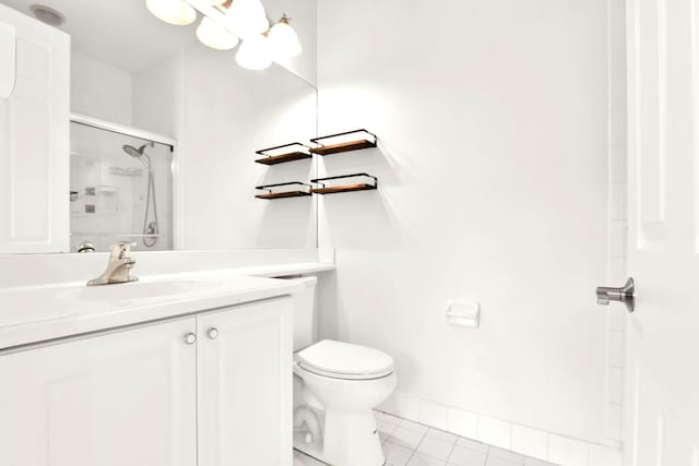 1246 Via De Fossi, Boynton Beach, FL 33426 - bathroom with tile patterned floors, a shower with door, vanity, toilet, and baseboards