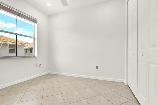 1246 Via De Fossi, Boynton Beach, FL 33426 - unfurnished bedroom with baseboards, light tile patterned floors, a closet, recessed lighting, and a ceiling fan
