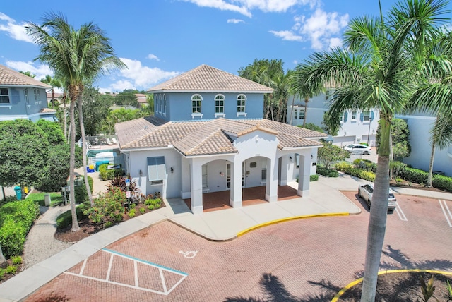 1246 Via De Fossi, Boynton Beach, FL 33426 - rear view of house with stucco siding and a tiled roof