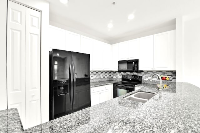 1246 Via De Fossi, Boynton Beach, FL 33426 - kitchen with black appliances, a sink, decorative backsplash, white cabinets, and recessed lighting