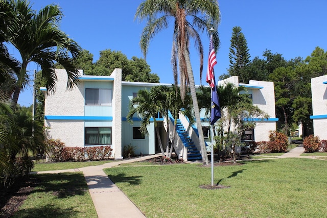 1560 NE 12th Ter Unit D9, Jensen Beach, FL 34957 - view of building exterior featuring stairs