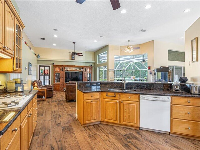 6575 NW Pomona Ct, Port Saint Lucie, FL 34983 - kitchen featuring white dishwasher, a ceiling fan, dark wood-type flooring, a textured ceiling, and recessed lighting