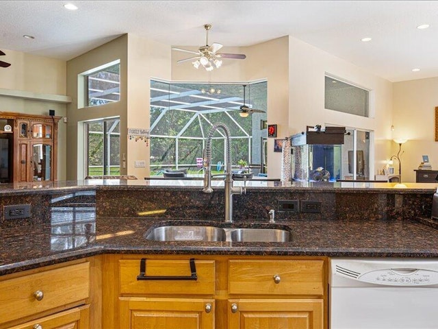 6575 NW Pomona Ct, Port Saint Lucie, FL 34983 - kitchen with dishwasher, a ceiling fan, dark stone counters, and recessed lighting