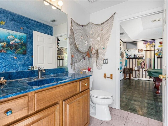 6575 NW Pomona Ct, Port Saint Lucie, FL 34983 - bathroom featuring vanity, tile patterned flooring, wallpapered walls, and billiards