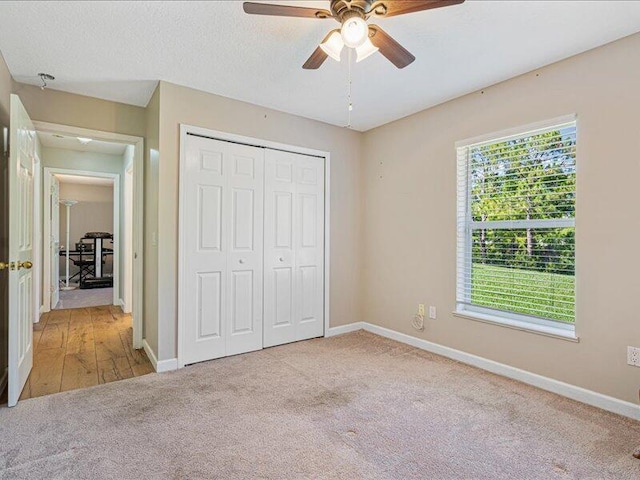 6575 NW Pomona Ct, Port Saint Lucie, FL 34983 - unfurnished bedroom with carpet, a closet, and ceiling fan