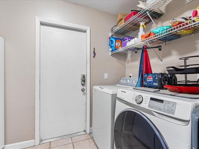 6575 NW Pomona Ct, Port Saint Lucie, FL 34983 - washroom featuring independent washer and dryer and light tile patterned floors
