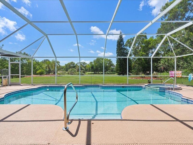 6575 NW Pomona Ct, Port Saint Lucie, FL 34983 - view of swimming pool with a patio, a pool with connected hot tub, glass enclosure, and view of scattered trees