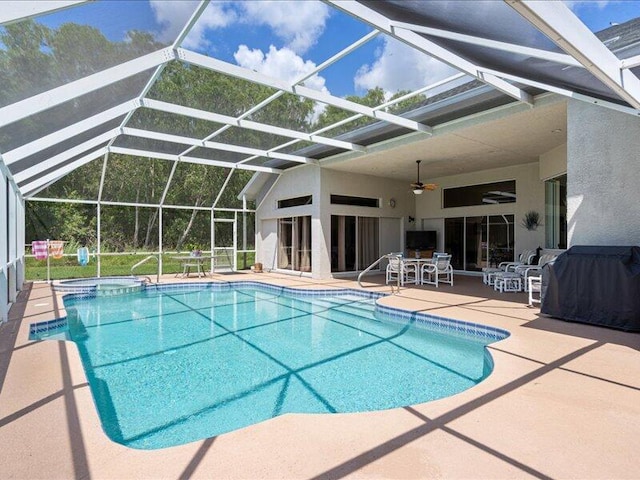 6575 NW Pomona Ct, Port Saint Lucie, FL 34983 - view of swimming pool with a patio, a grill, a pool with connected hot tub, and ceiling fan