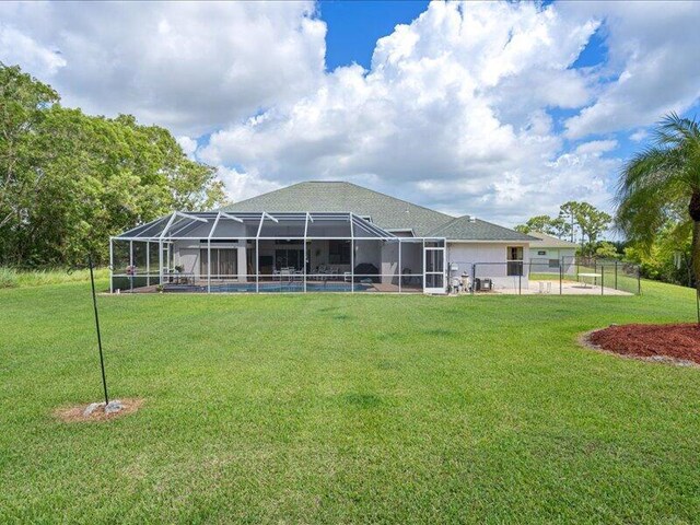 6575 NW Pomona Ct, Port Saint Lucie, FL 34983 - rear view of house featuring a lanai