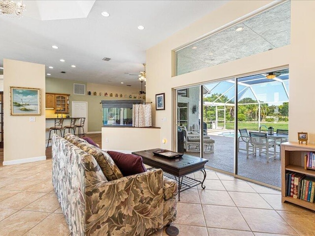 6575 NW Pomona Ct, Port Saint Lucie, FL 34983 - living area featuring a sunroom, ceiling fan, light tile patterned flooring, and recessed lighting