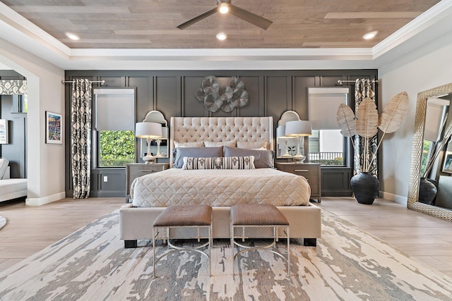 122 Cerulean Key Way, Jupiter, FL 33478 - bedroom featuring baseboards, light wood-type flooring, a raised ceiling, crown molding, and wood ceiling