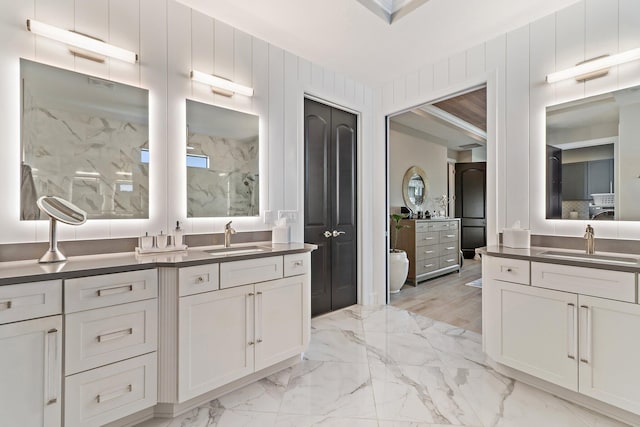 122 Cerulean Key Way, Jupiter, FL 33478 - bathroom featuring marble look tile flooring, a marble finish shower, and two vanities