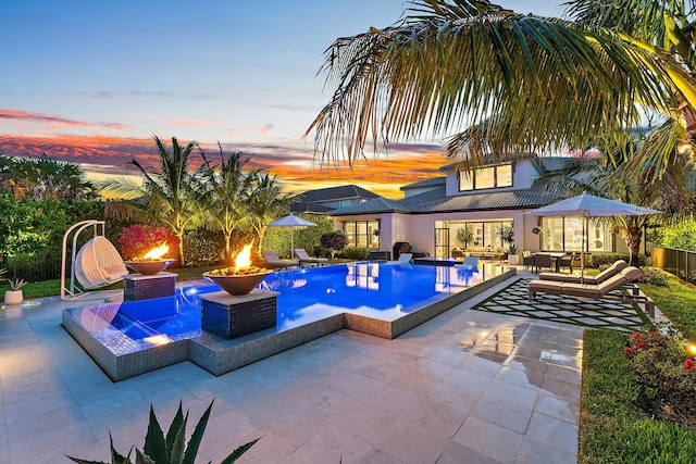 122 Cerulean Key Way, Jupiter, FL 33478 - swimming pool with a patio and an outdoor living space with a fire pit
