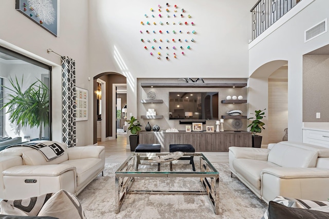 122 Cerulean Key Way, Jupiter, FL 33478 - living area featuring arched walkways and a towering ceiling