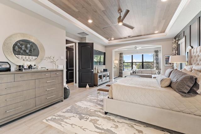 122 Cerulean Key Way, Jupiter, FL 33478 - bedroom featuring a tray ceiling, light wood-style floors, wooden ceiling, arched walkways, and a ceiling fan