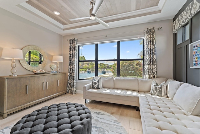 122 Cerulean Key Way, Jupiter, FL 33478 - living area with a tray ceiling, light wood-style flooring, ceiling fan, ornamental molding, and baseboards