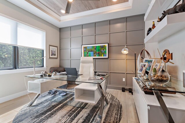 122 Cerulean Key Way, Jupiter, FL 33478 - office area featuring a tray ceiling, crown molding, a decorative wall, light wood finished floors, and baseboards