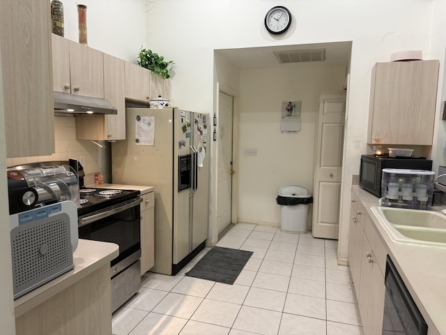 4050 Gator Trace Rd, Fort Pierce, FL 34982 - kitchen featuring under cabinet range hood, dishwashing machine, stainless steel electric stove, and light brown cabinetry