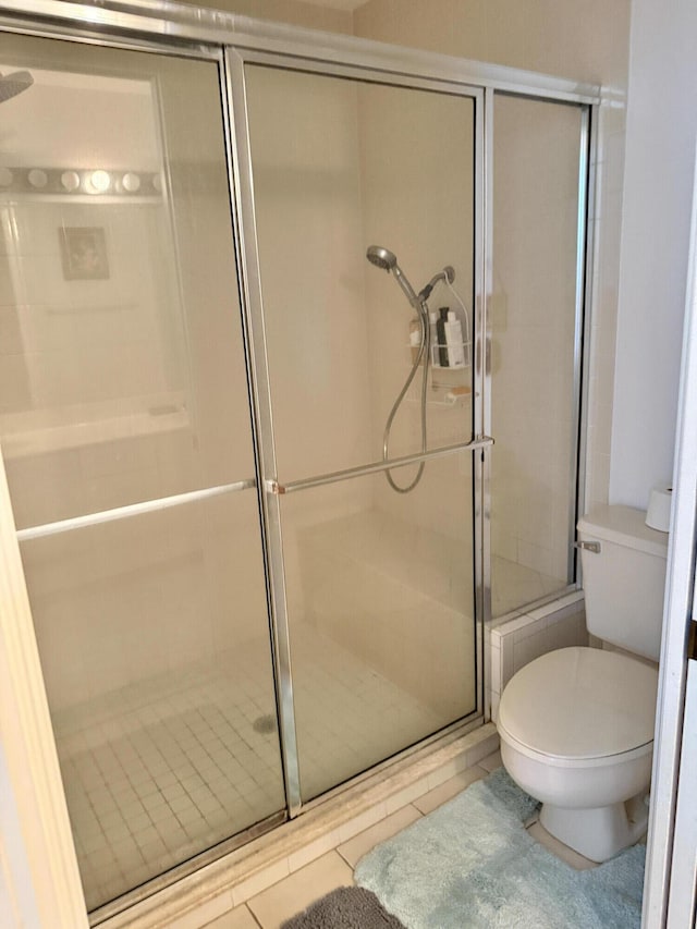 4050 Gator Trace Rd, Fort Pierce, FL 34982 - full bathroom featuring toilet, a shower stall, and tile patterned floors