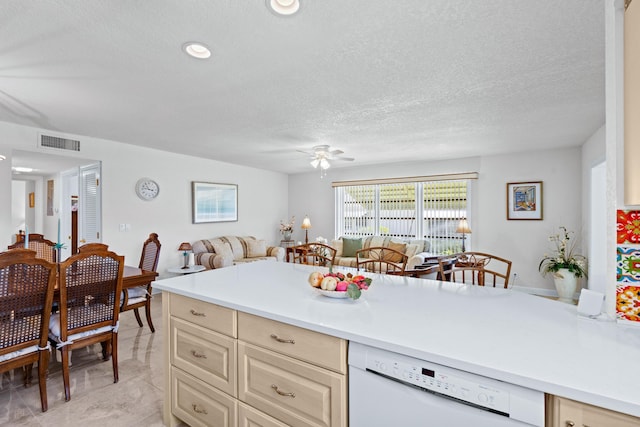 201 Bayview Ave Unit D, Boynton Beach, FL 33435 - kitchen featuring white dishwasher, open floor plan, ceiling fan, light countertops, and cream cabinetry