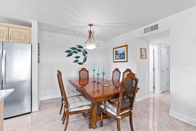 201 Bayview Ave Unit D, Boynton Beach, FL 33435 - dining area with baseboards and light tile patterned floors