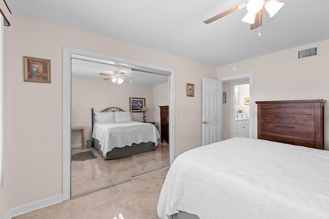 201 Bayview Ave Unit D, Boynton Beach, FL 33435 - bedroom featuring a closet, ceiling fan, baseboards, and light marble finish flooring