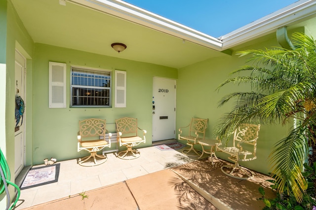 201 Bayview Ave Unit D, Boynton Beach, FL 33435 - entrance to property with stucco siding and a patio area