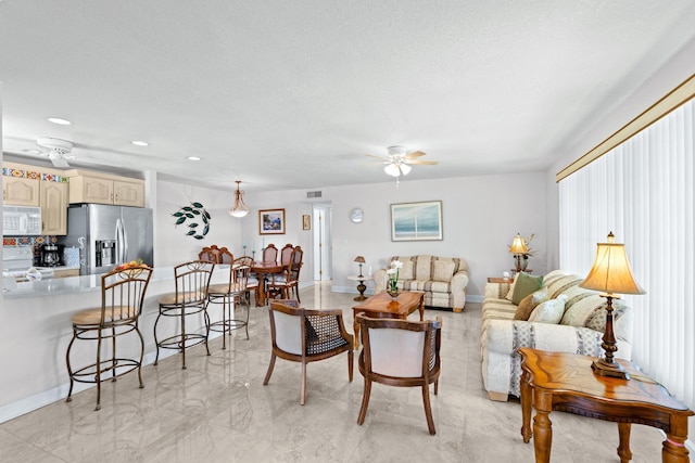 201 Bayview Ave Unit D, Boynton Beach, FL 33435 - living area with a ceiling fan, baseboards, recessed lighting, a textured ceiling, and light marble finish flooring