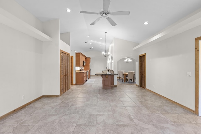 unfurnished living room with a chandelier, recessed lighting, ceiling fan, baseboards, and high vaulted ceiling