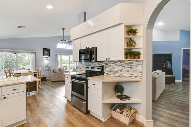 1644 Oak Berry Cir, Wellington, FL 33414 - kitchen with electric stove, open shelves, open floor plan, ceiling fan, and white cabinetry