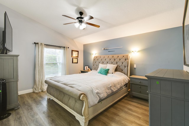 1644 Oak Berry Cir, Wellington, FL 33414 - bedroom with vaulted ceiling, wood finished floors, baseboards, and a ceiling fan