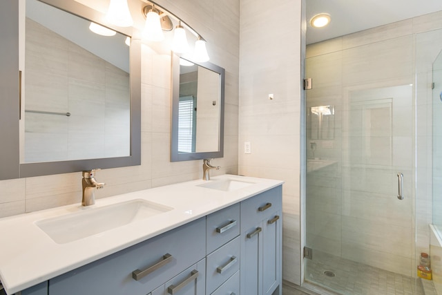1644 Oak Berry Cir, Wellington, FL 33414 - full bath with tile walls, double vanity, a shower stall, and tasteful backsplash