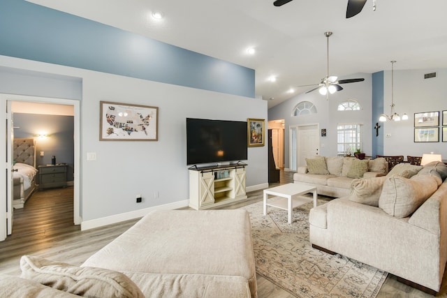 1644 Oak Berry Cir, Wellington, FL 33414 - living room with ceiling fan, wood finished floors, a chandelier, baseboards, and high vaulted ceiling