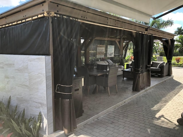 view of patio featuring a gazebo and an outdoor hangout area