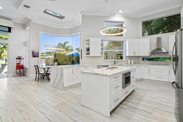 16313 Mira Vista Ln, Delray Beach, FL 33446 - kitchen with appliances with stainless steel finishes, wall chimney range hood, a high ceiling, crown molding, and recessed lighting