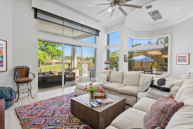 16313 Mira Vista Ln, Delray Beach, FL 33446 - living room featuring crown molding, a ceiling fan, light wood-style floors, and a towering ceiling