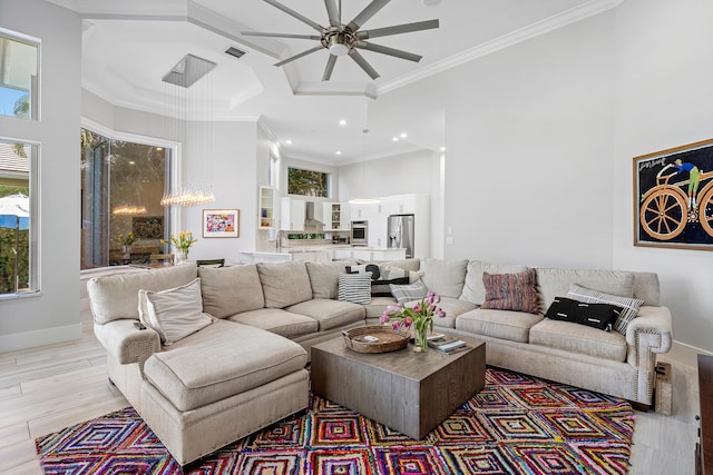 16313 Mira Vista Ln, Delray Beach, FL 33446 - living area with ceiling fan, a towering ceiling, ornamental molding, recessed lighting, and light wood-type flooring
