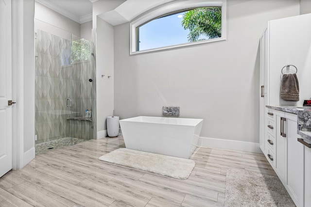 16313 Mira Vista Ln, Delray Beach, FL 33446 - full bathroom featuring a shower stall, crown molding, a freestanding tub, vanity, and baseboards