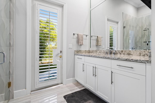 16313 Mira Vista Ln, Delray Beach, FL 33446 - full bathroom featuring a shower stall, healthy amount of natural light, vanity, and ornamental molding